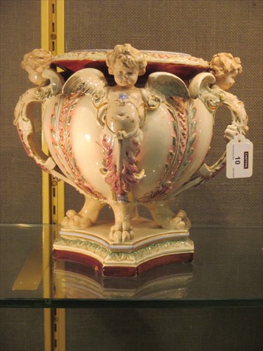Lot 10 - A Hugo Lonitz jadeniere with winged cherub handles.