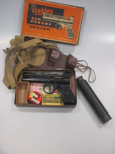 Lot 40 - The Webley 'Junior Model' Air Pistol (boxed) together with an early 20th century 3 draw telescope Falcon 22 x Enbeeco London (2)