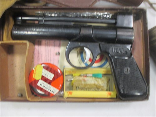Lot 40 - The Webley 'Junior Model' Air Pistol (boxed) together with an early 20th century 3 draw telescope Falcon 22 x Enbeeco London (2)
