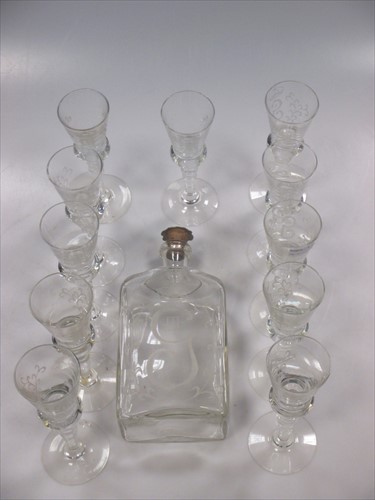 Lot 18 - A glass cordial decanter and 11 glasses engraved with coronet above G