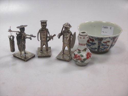 Lot 165 - A set of 3 Chinese silver figure, a teabowl and small bottle.