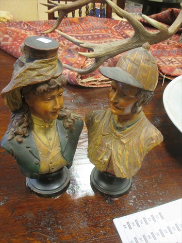 Lot 83 - A pair of Continental pottery busts of two...