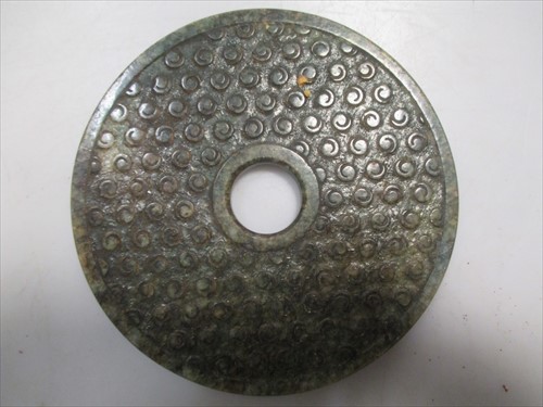 Lot 171 - A Jade bi, 12cm diameter