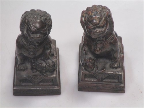 Lot 22 - A pair of Chinese bronze lions, 12cm high