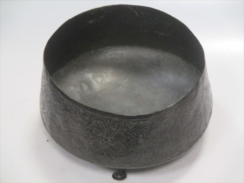 Lot 8 - A Persian bronze bowl, raised on three feet,...