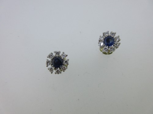Lot 163 - A pair of sapphire and diamond cluster earstuds