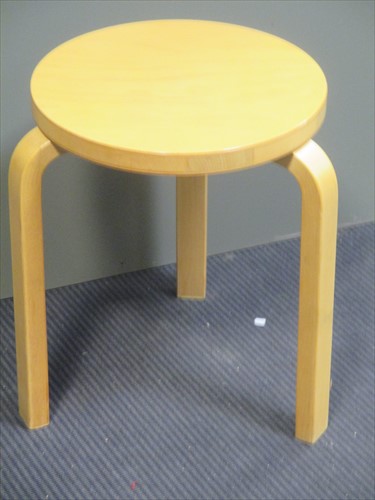 Lot 649 - A 20th century three legged stool after...