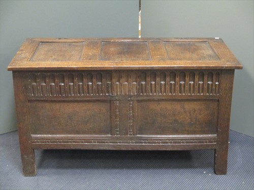 Lot 549 - An early 18th century oak coffer with triple...