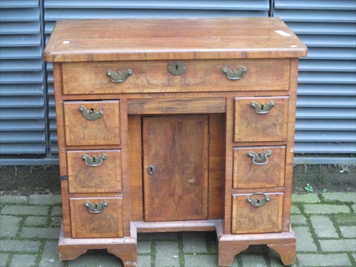 Lot 628 - A 19th century walnut knee hole desk