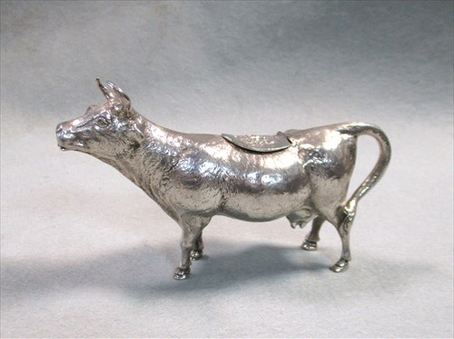 Lot 382 - A German 20th century silver cast naturalistic cow creamer