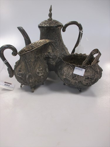 Lot 253 - An Asian whitemetal three piece teaset
