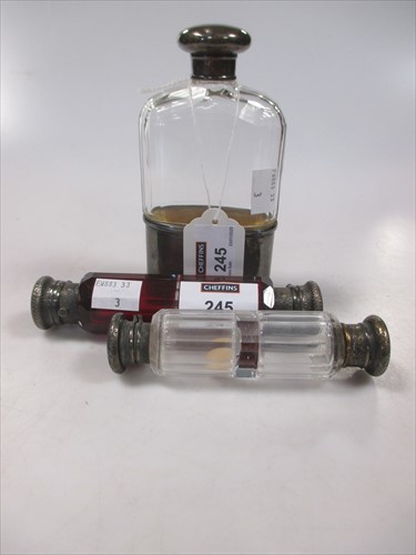 Lot 245 - An Edwardian cut glass hip flask with silver...