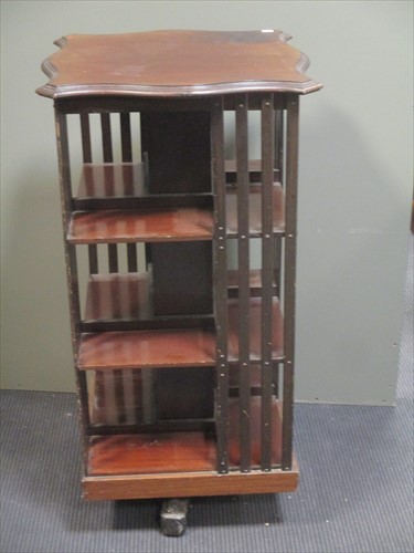 Lot 644 - An Edwardian mahogany revolving bookcase 102cm...