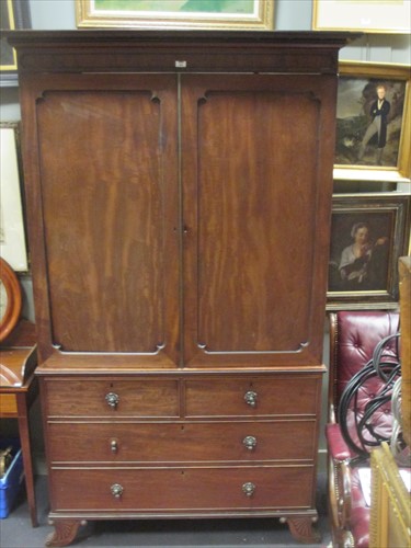 Lot 484 - A late Regency mahogany linen press 226cm x...