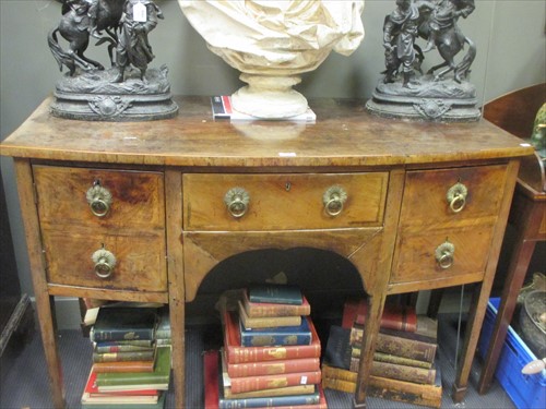Lot 482 - A late Regency mahogany bowfront sideboard...
