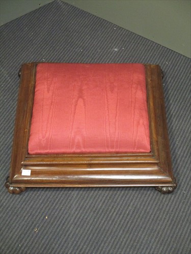 Lot 558 - A Victorian rosewood foot stool, square form of shaped feet.
