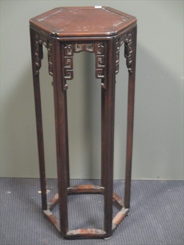 Lot 473 - An early 20th century Chinese hardwood jardiniere stand.