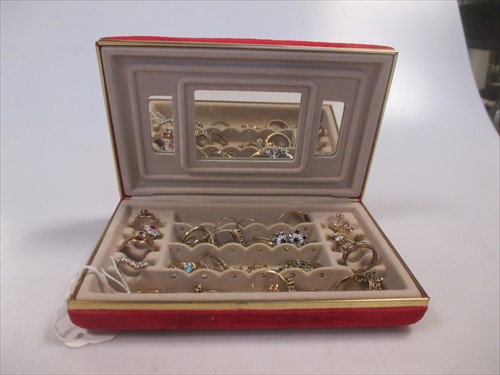 Lot 223 - A red jewellery box containing a large...