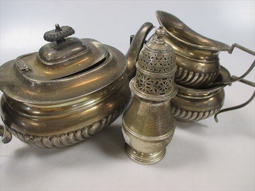 Lot 246 - A silver three piece tea set together with a...