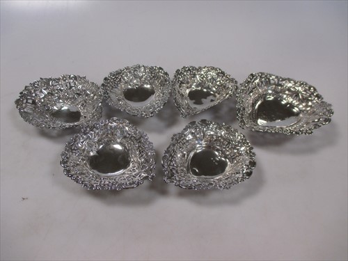 Lot 237 - Six silver pierced pin trays, two silver bowls...