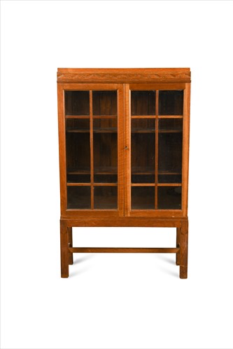 Lot 171 - A Cotswold School glazed oak cabinet