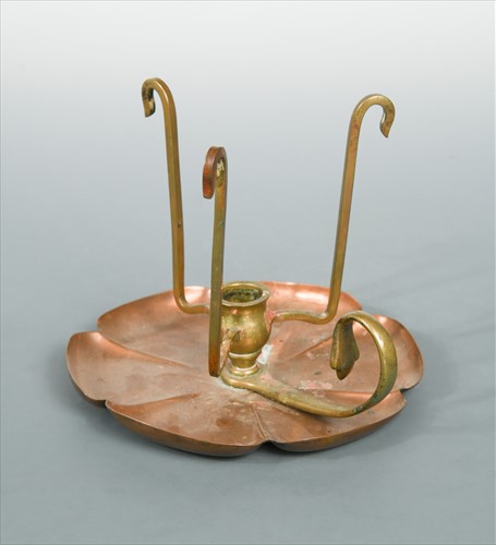 Lot 125 - A rare W.A.S Benson copper and brass chamberstick
