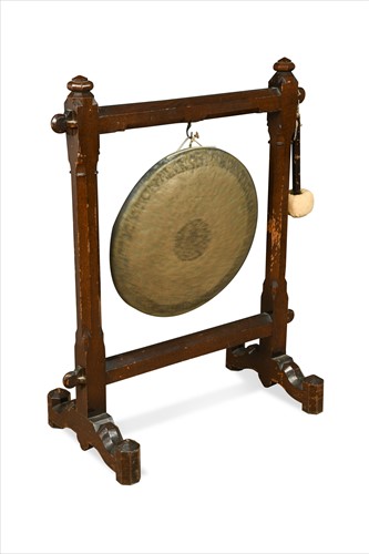 Lot 150 - A floor-standing oak framed Gothic dinner gong