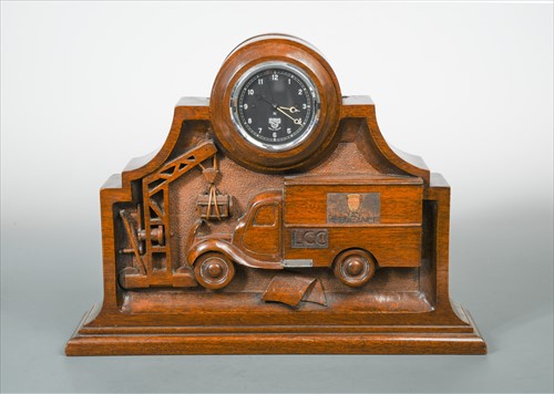 Lot 133 - A WWII carved wood novelty mantle clock