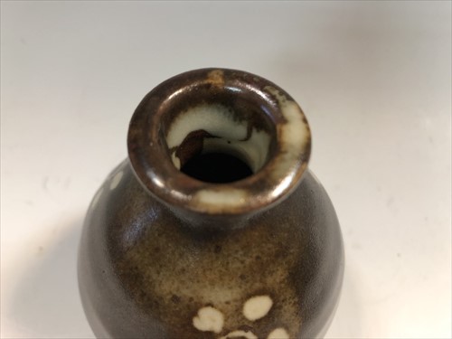 Lot 52 - Bernard Leach (British, 1887-1979), a miniature stoneware vase