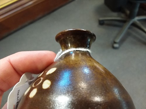 Lot 52 - Bernard Leach (British, 1887-1979), a miniature stoneware vase