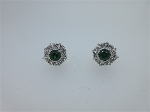 Lot 140 - A pair of green and white hardstone cluster screwback earrings
