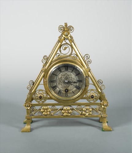 Lot 122 - A late Victorian Gothic style brass desk clock