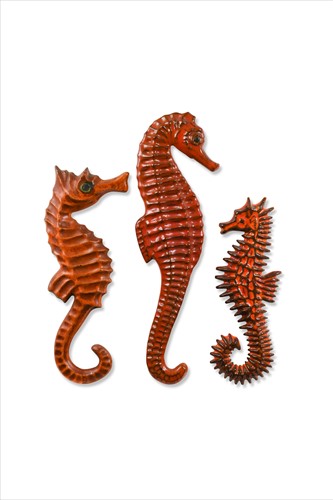 Lot 48 - A graduated matched set of three Sanchez & Bayer orange glazed seahorses