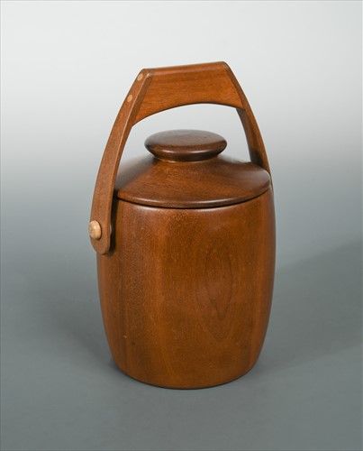 Lot 140 - In the manner of Jens Quistgaard, a mid-century Danish teak biscuit jar and cover