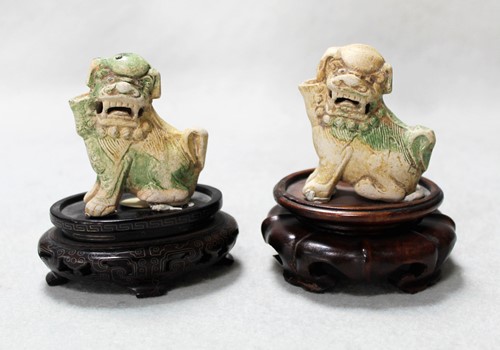 Lot 81 - Two Chinese porcelain fo-dog joss stick holders