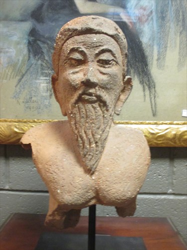 Lot 80 - A terracotta bust of a bearded Oriental man on...