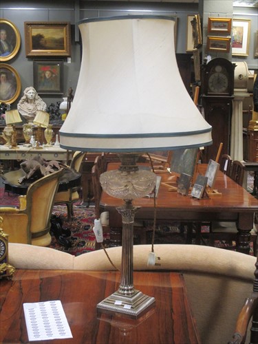 Lot 145 - A plated Corinthian column and cut glass oil...