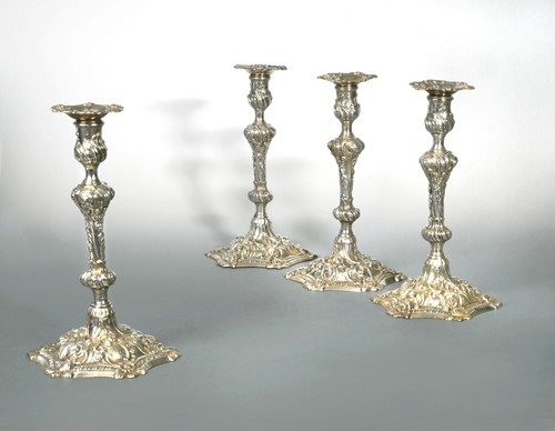 Lot 401 - A set of 4 George III cast silver candlesticks