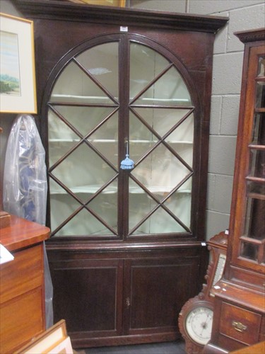 Lot 493 - A 19th Century glazed floorstanding corner...