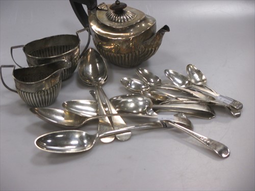 Lot 242 - A small silver three piece tea set, together...
