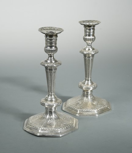 Lot 394 - A pair of Queen Anne Britannia silver cast candlesticks
