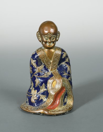 Lot 25 - A Chinese Champleve enamel and bronze model of a lohan, Qianlong