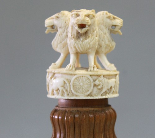 Lot 250 - A Ceylonese carved wood and ivory Capital of Ashoka desk piece, circa 1930