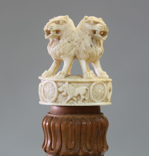 Lot 250 - A Ceylonese carved wood and ivory Capital of Ashoka desk piece, circa 1930