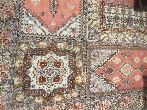 Lot 676 - A large peach ground carpet with geometric...