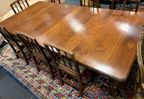 Lot 567 - Late 19th century walnut dining table with two...