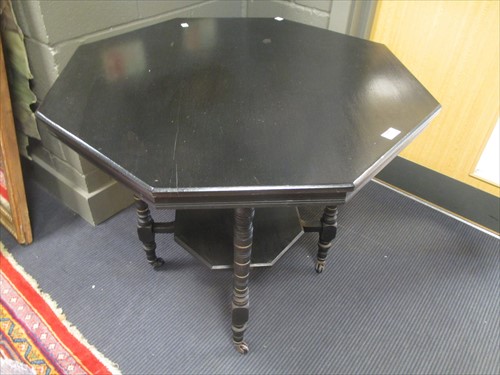 Lot 453 - A black painted aesthetic movement octagonal...