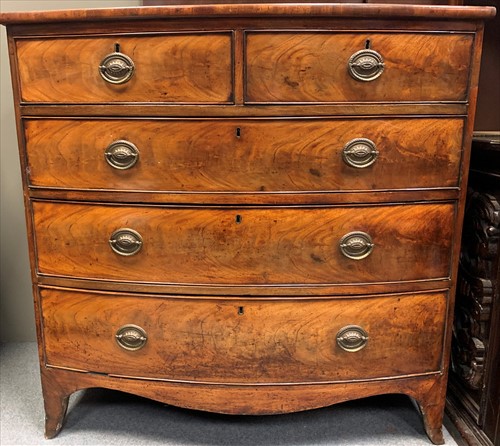 Lot 617 - A George III figured mahogany and ebony strung...
