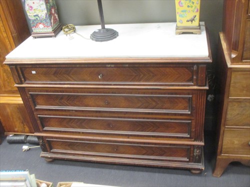 Lot 488 - A French marble topped commode with four long...