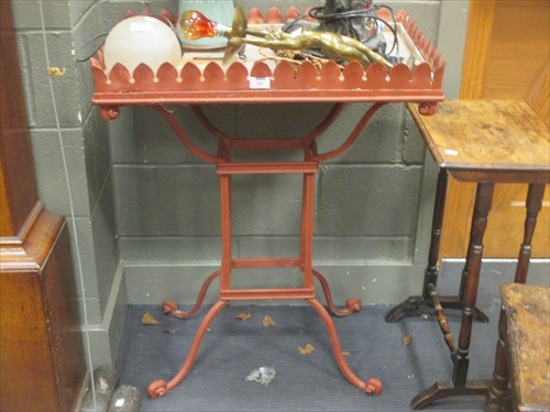 Lot 497 - A wrought iron garden planter table with stiff...